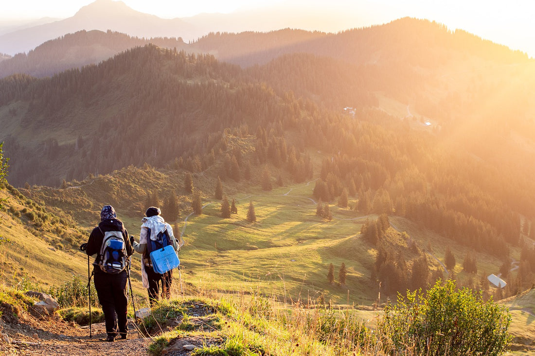 two people hiking a mountain